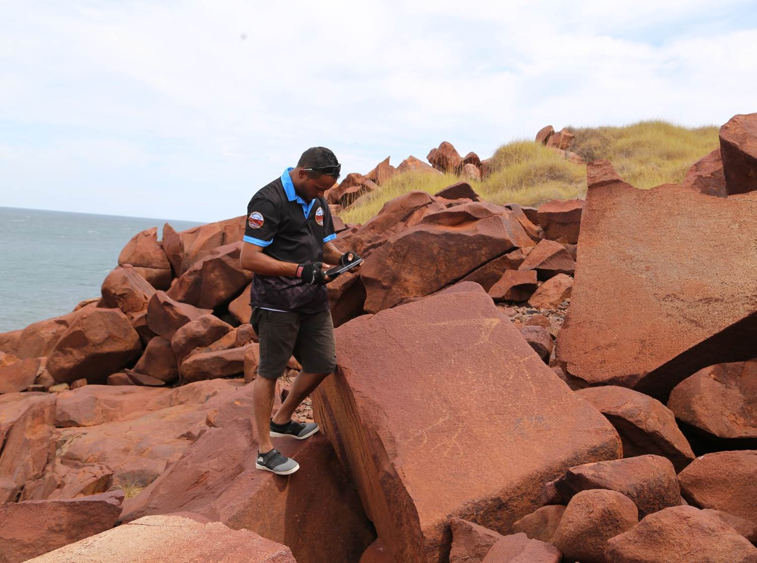 MAC Ranger recording rock art on Enderby Island